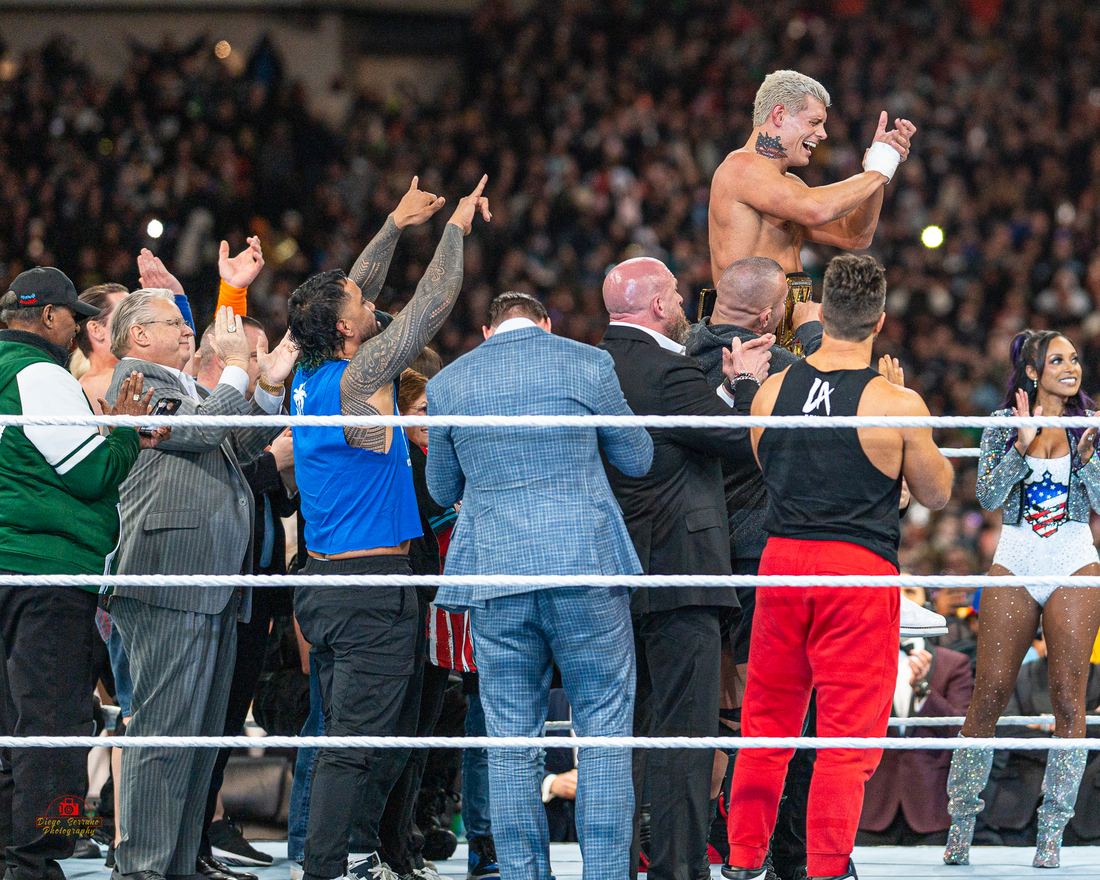 Cody Rhodes surrounded by wrestlers and family in the ring after winning the title at WrestleMania XL