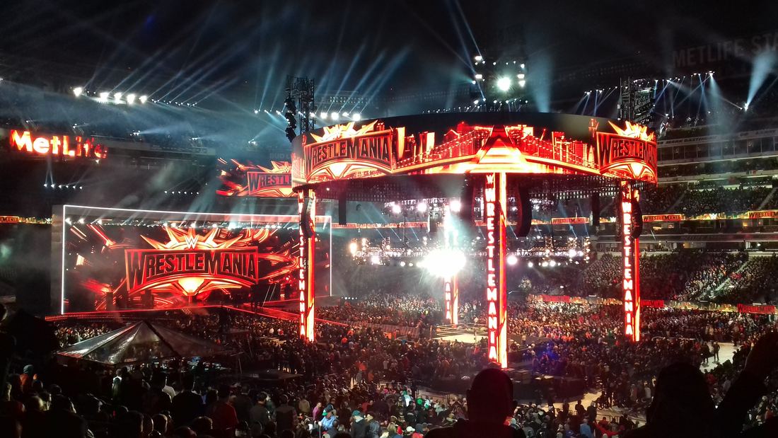The packed stadium and lit-up ring at MetLife Stadium before the WrestleMania 35 main event